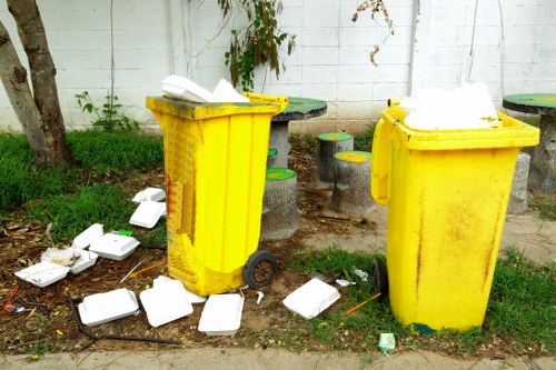 Rubbish clearance service in action at a building site